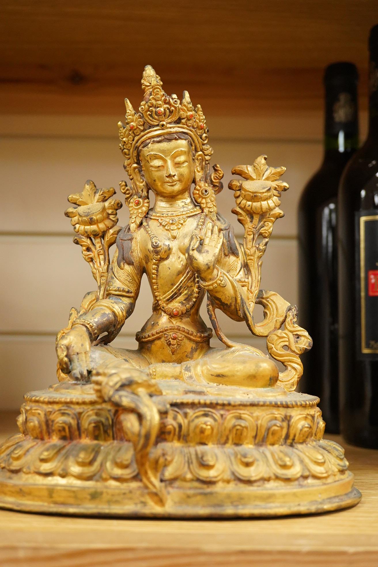 A Sino Tibetan gilt bronze figure of Green Tara, 23cm high